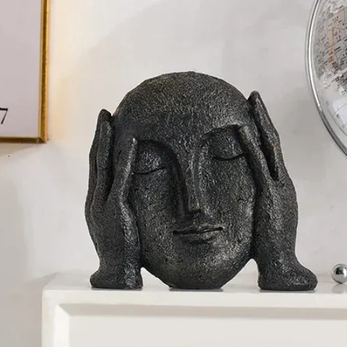 ESCULTURA MANOS EN EL ROSTRO